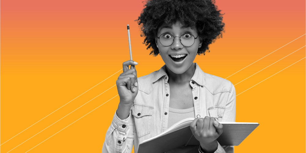 young woman with glasses smiling and holding a pencil ready to share fun financial Christmas facts