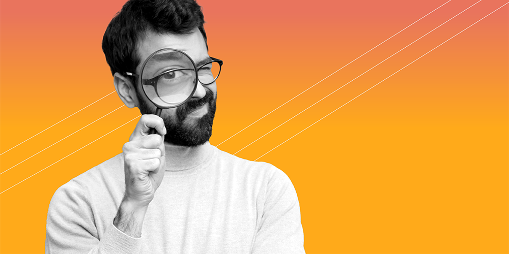 man with beard and glasses looking through a magnifying glass to bust financial myths