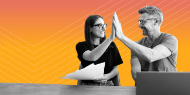 man and woman both wearing glasses and giving each other a high 5 after learning how to get a job in financial education