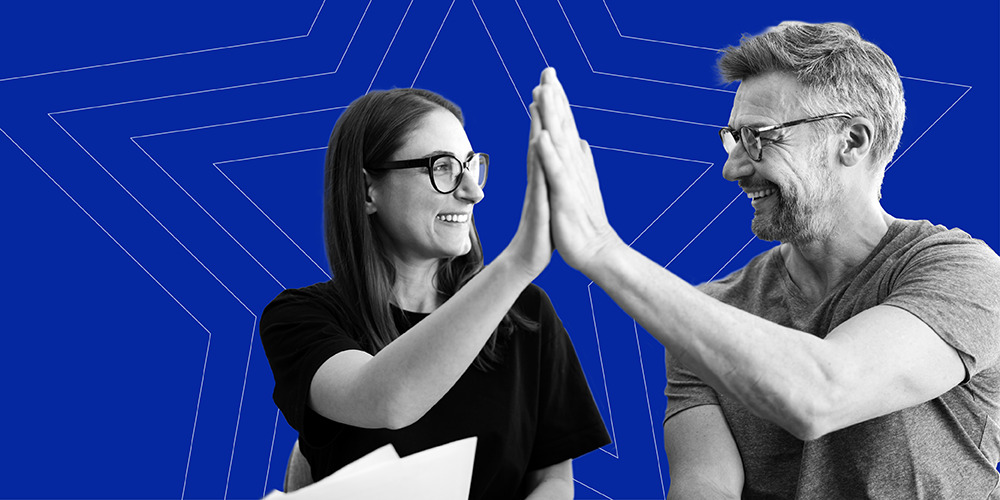 couple giving each other a high five after learning 11 super-smart hacks to never forget a bill payment
