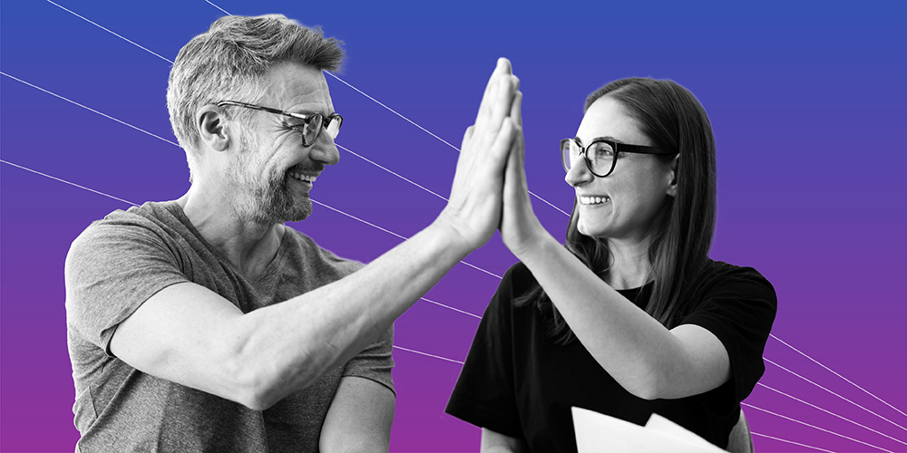 man and woman high fiving about the the no-spend challenge: stop spending and start saving